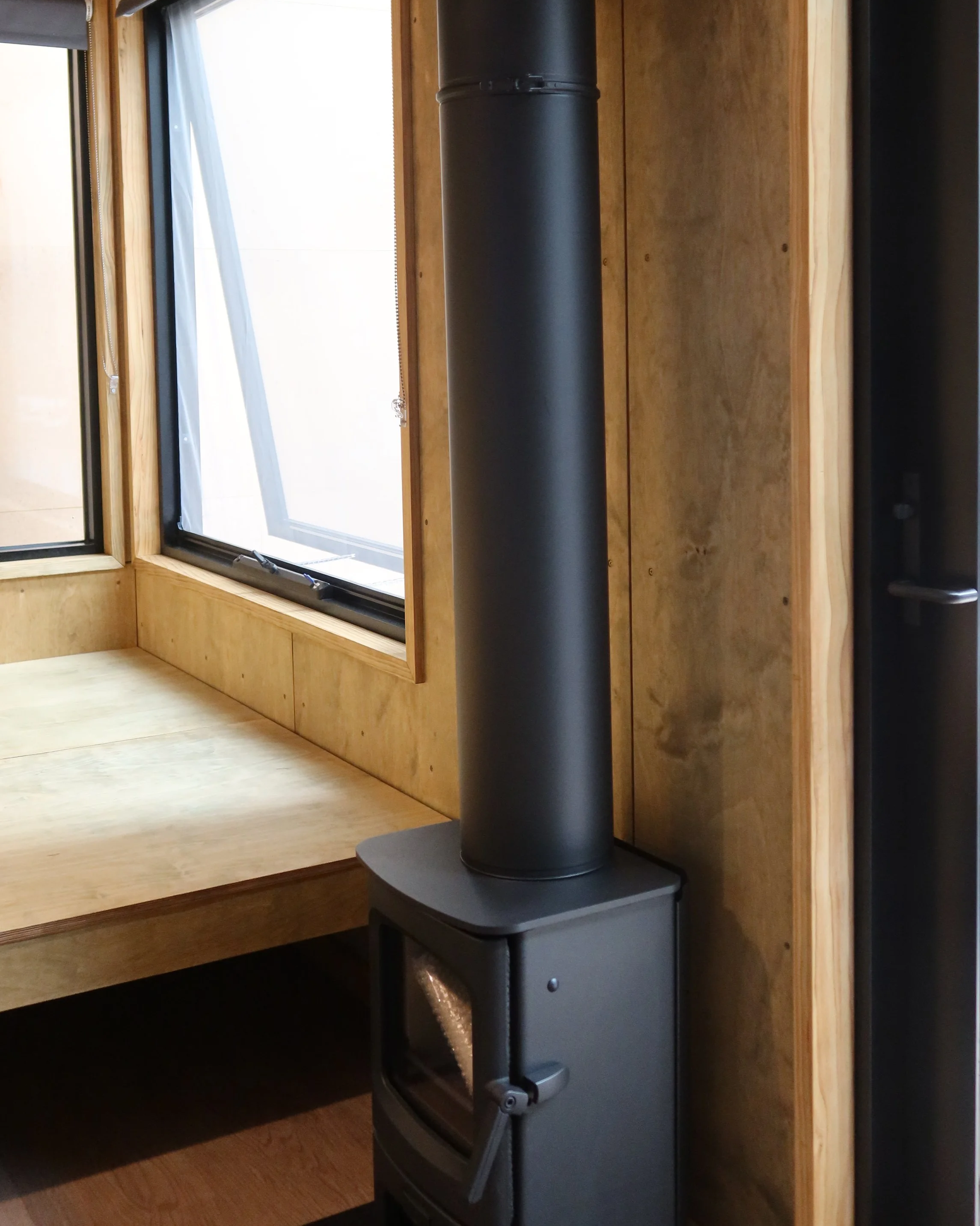 Explore the interior of an Alt.Form tiny home, including this cosy fire. 