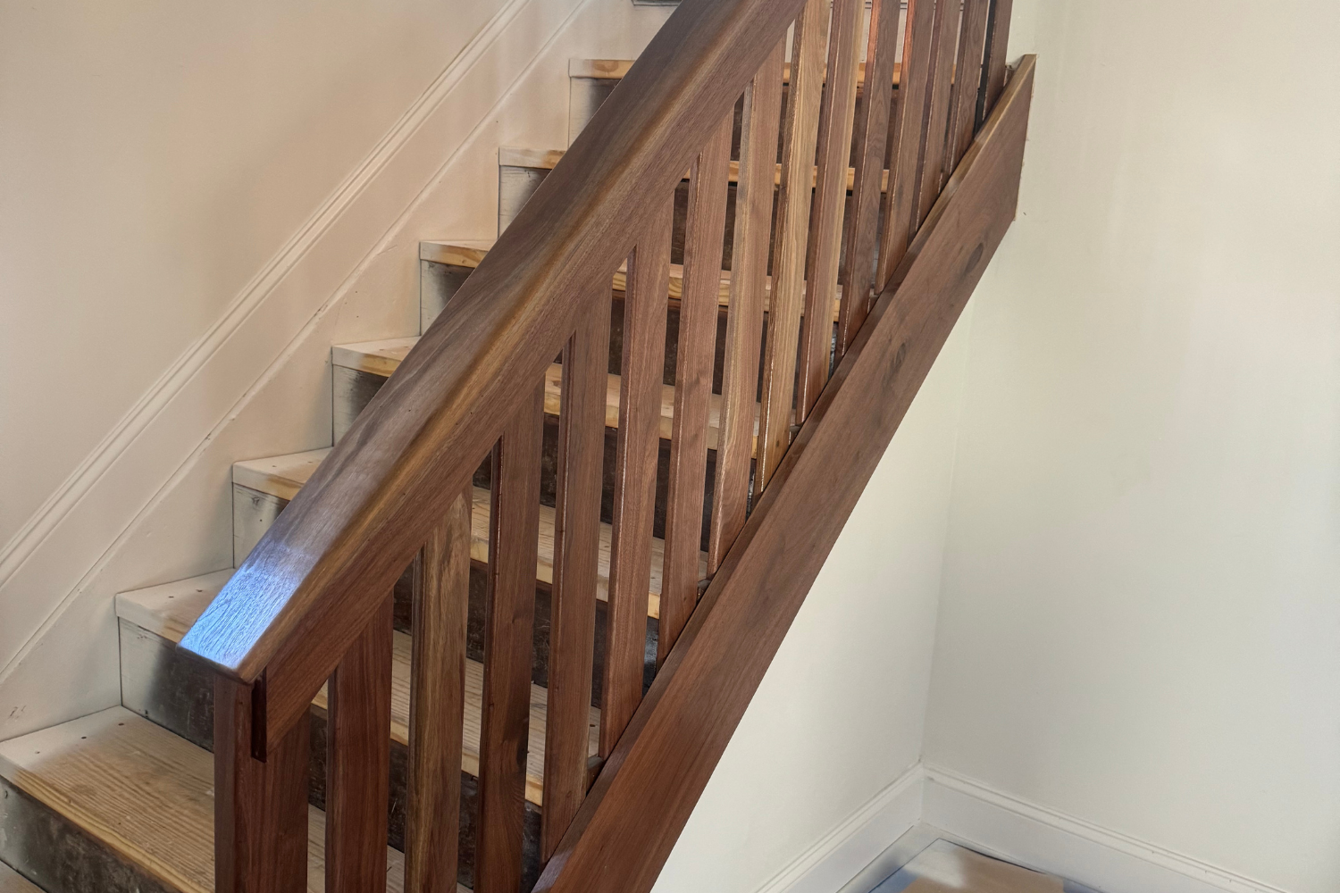 Oranssi technician working on a roof project