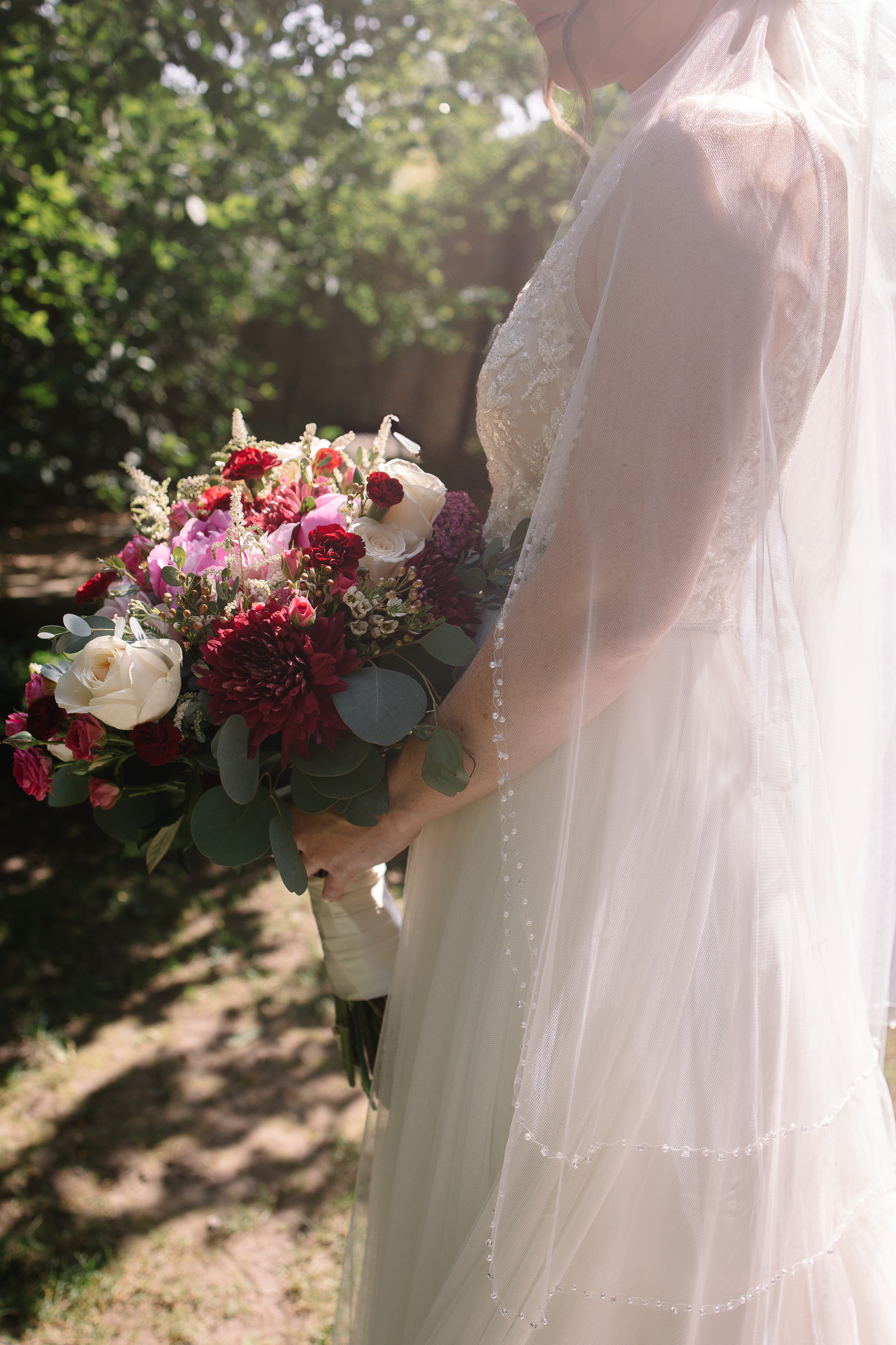 Detail image of a Bride holding her bouquet