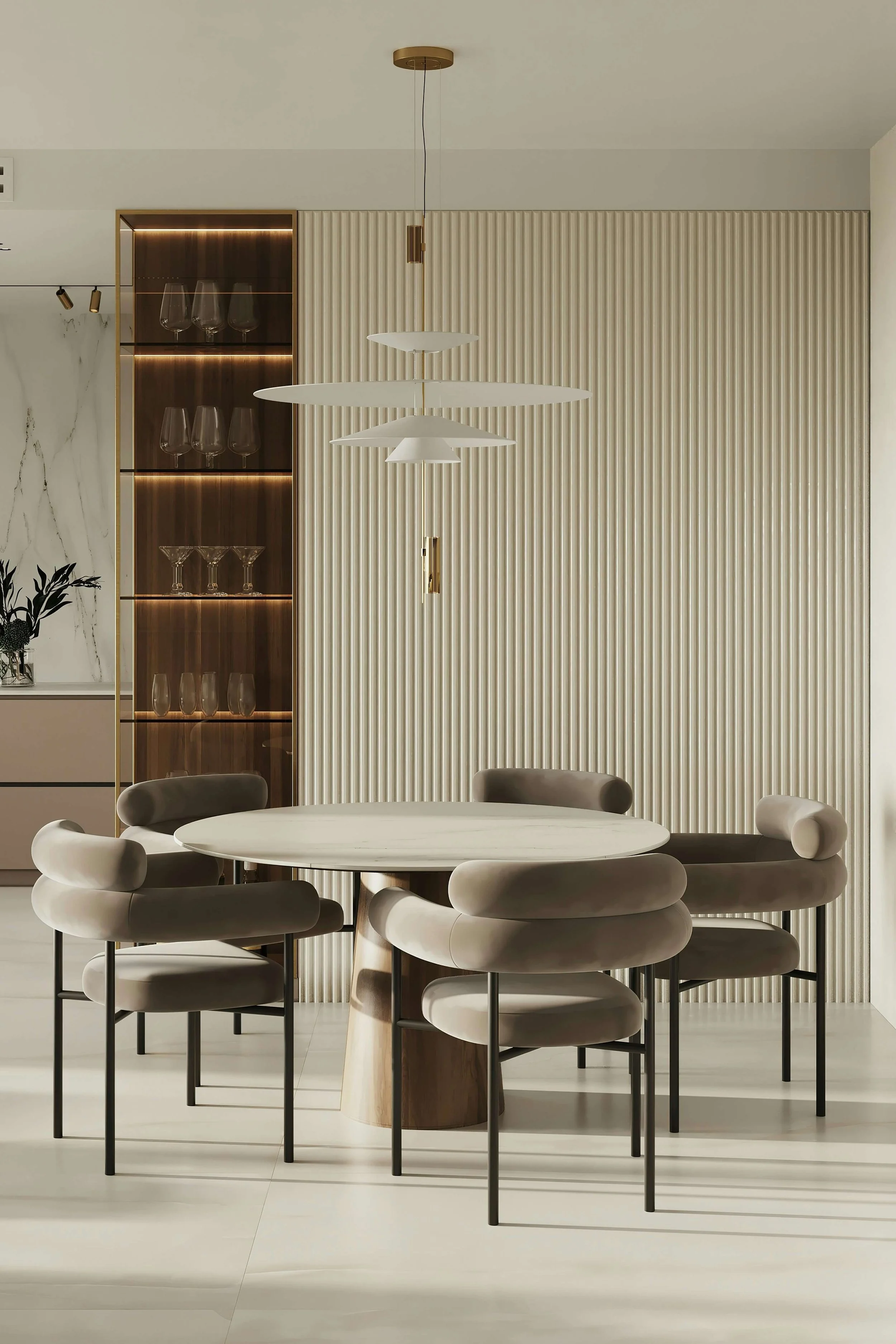 Modern dining room with round table, six upholstered chairs, minimalist pendant light, wooden cabinet with wine glasses, and textured wall panels.