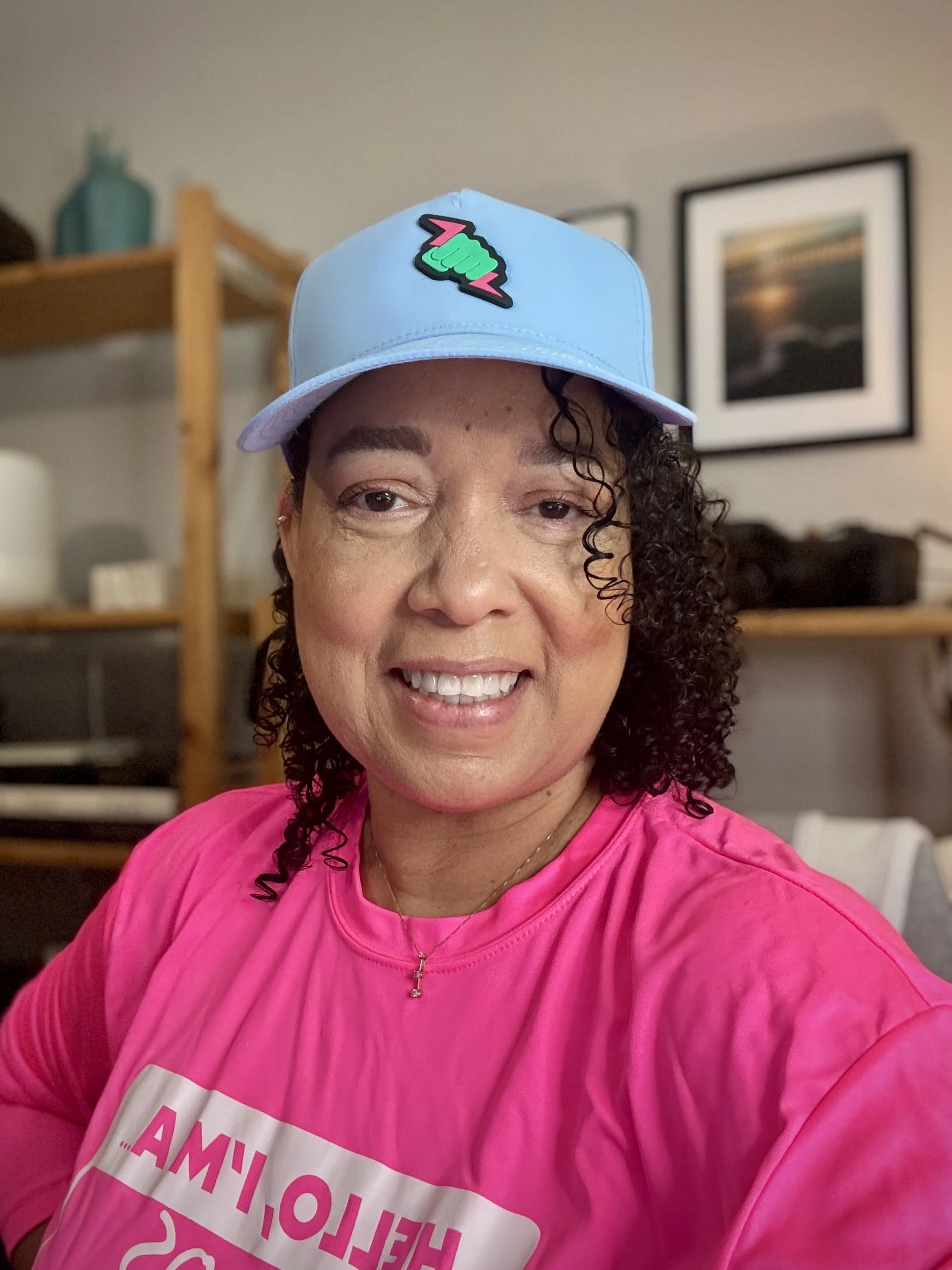 Christal on day 2 of Eventastic 2026! As a co-host of one of the Networking rooms, she is wearing Eventastic logo hat and shirt.