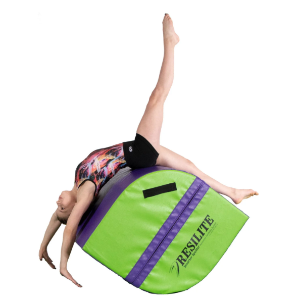 Child demonstrating a gymnastics move on a Resilite inflatable training mat.