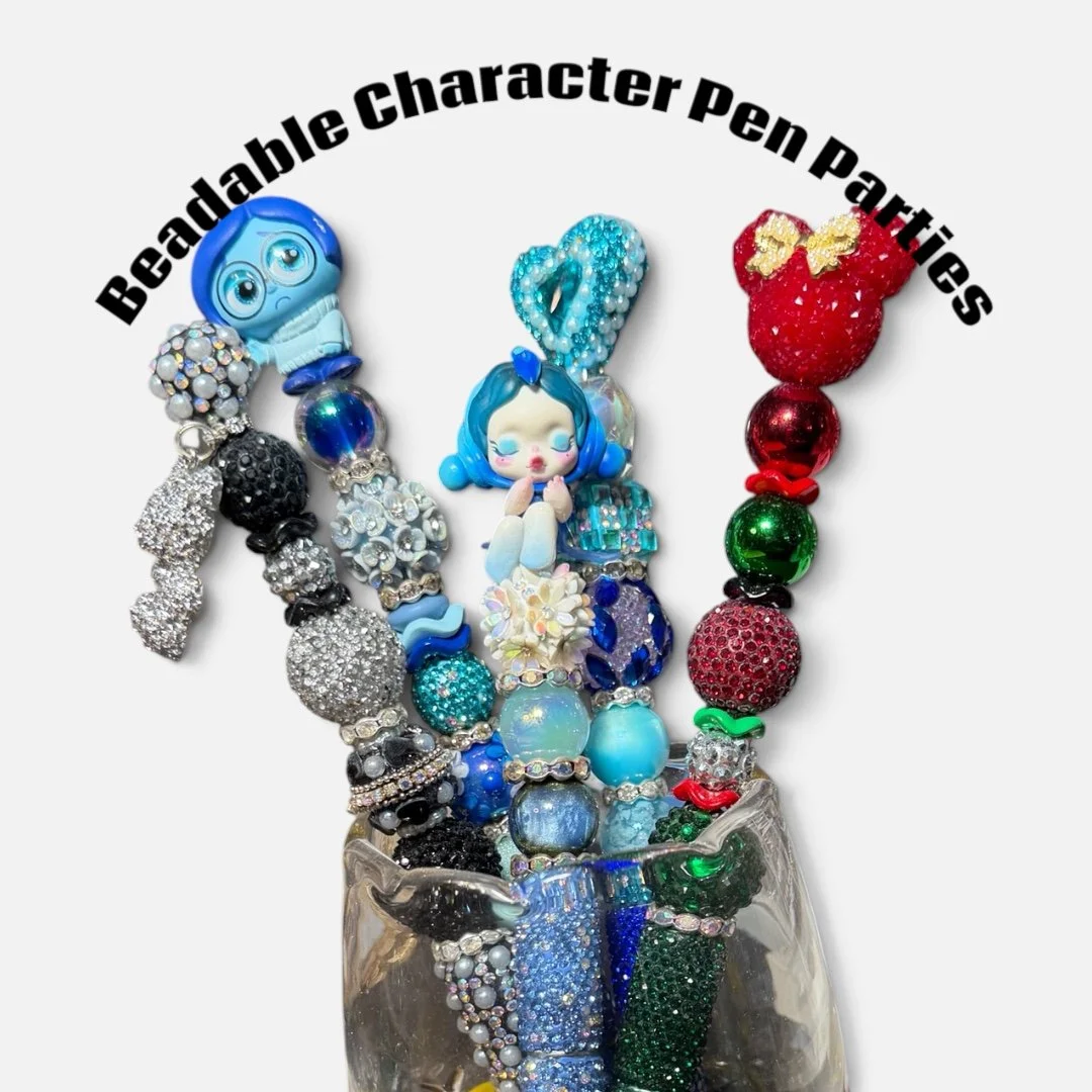 A collection of colorful bead charms designed for bracelets and necklaces, arranged in a glass container, with the text "Beadable Character Pen Particles" curved above them.