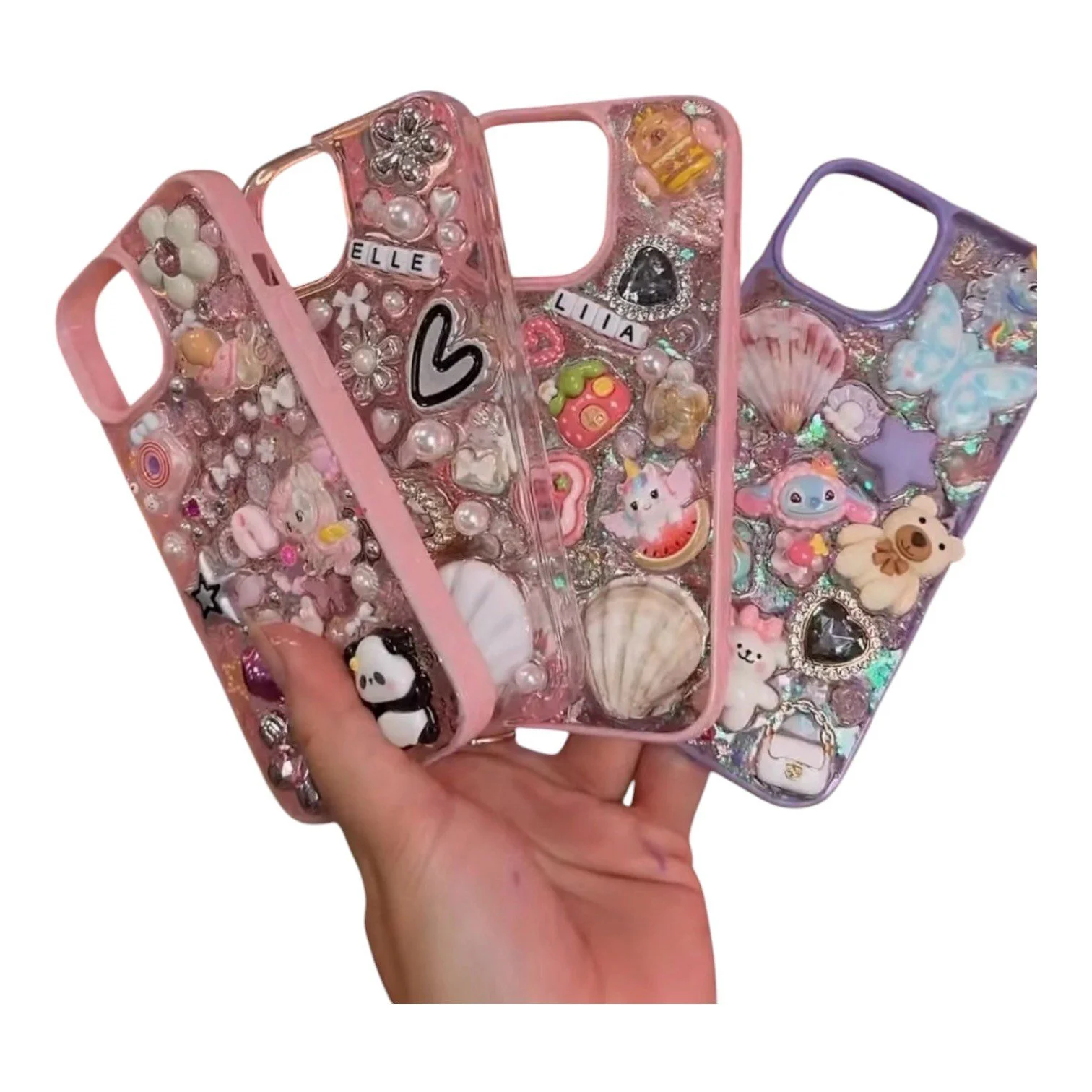 Three colorful phone cases decorated with charms, beads, and glitter, featuring animals, hearts, and bows design.