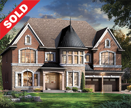 Large brick and stone two-story house with a steep roof, turret, and multiple windows, marked sold.