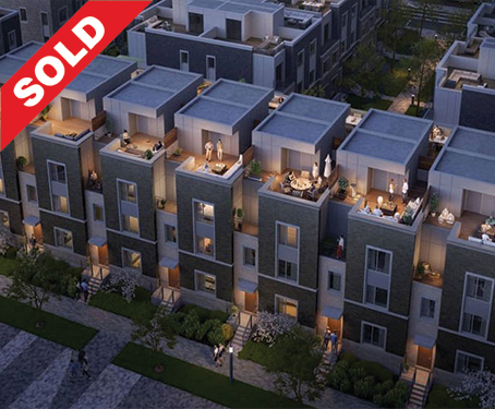 A 3D render of a modern apartment complex with rooftop patios, some with furniture and lighting, and a 'Sold' banner in the top left corner.