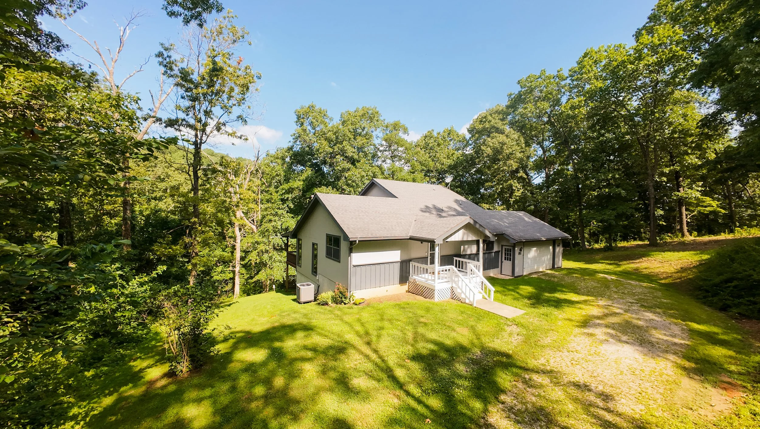 Aerial photos and video home tour of a 3 bed, 3 bath home on .26 acre lot with lakefront view. Click on image for more photos and home tour video
