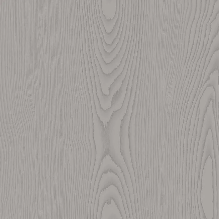 Close-up of a light-colored wooden surface with visible wood grain patterns.