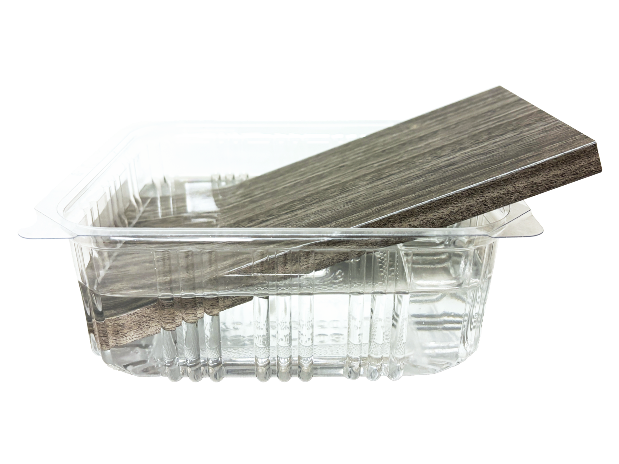Clear plastic food container with wood-textured black paper inside.