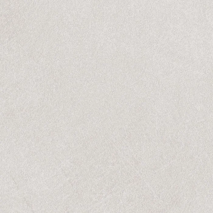 Close-up of a textured white surface, possibly paper or fabric.