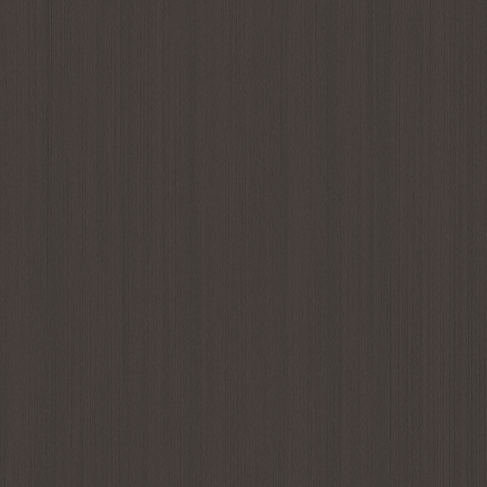 A close-up view of a textured dark gray surface, possibly a fabric or surface material.