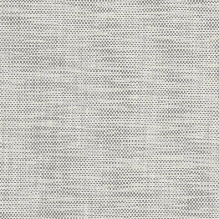 Close-up of a perforated sheet of metal or plastic with small evenly spaced holes.