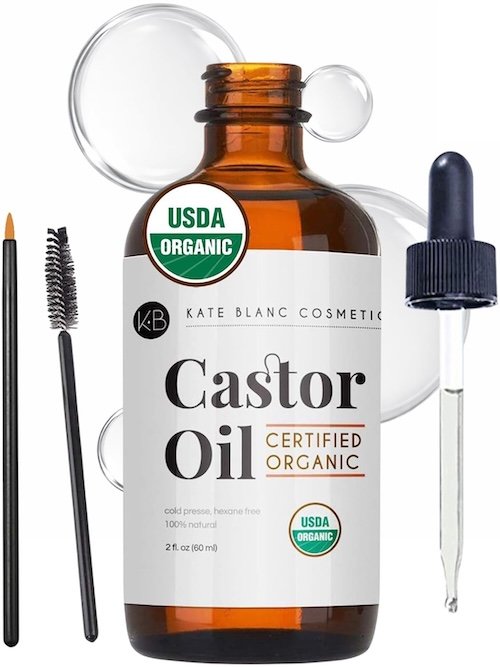 Castor oil dropper bottle with natural textures in the background