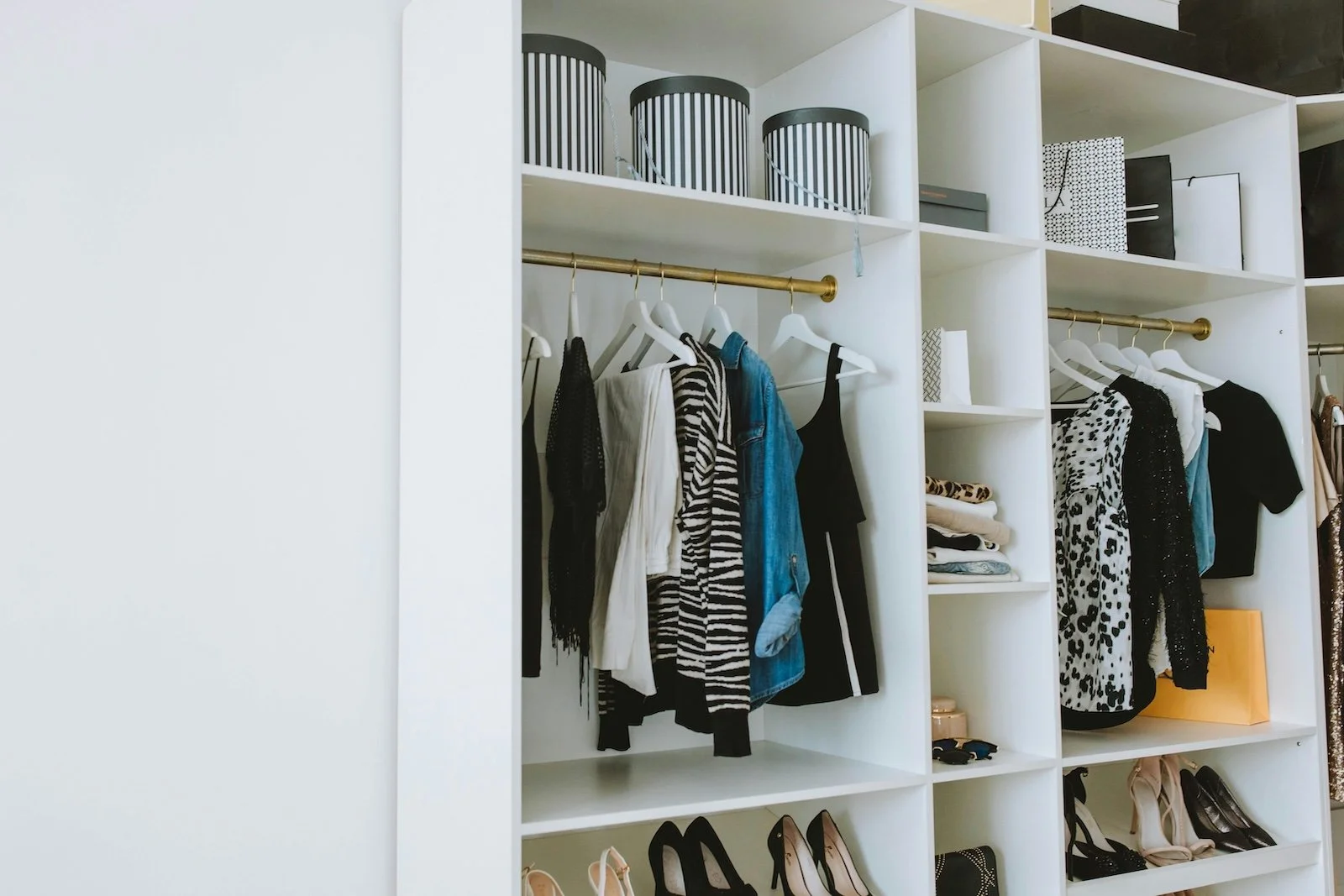 Closet shelf dividers keeping clothing stacks organized