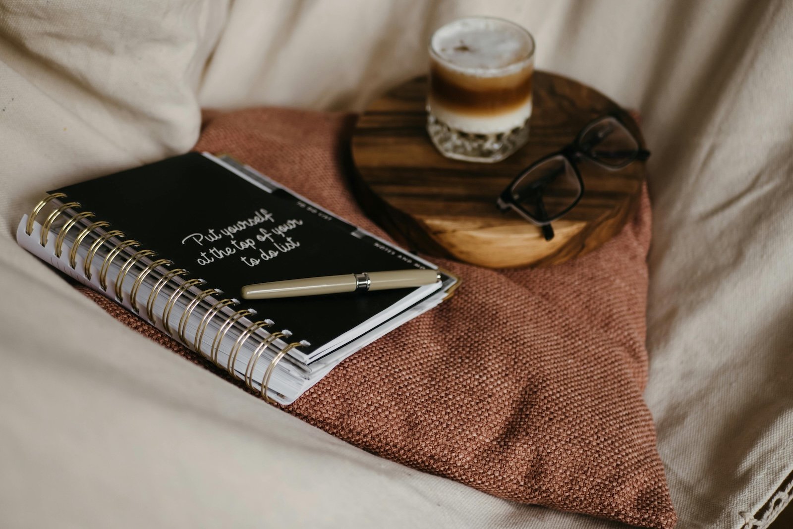Sunday reset routine with planner and coffee on a comfy couch