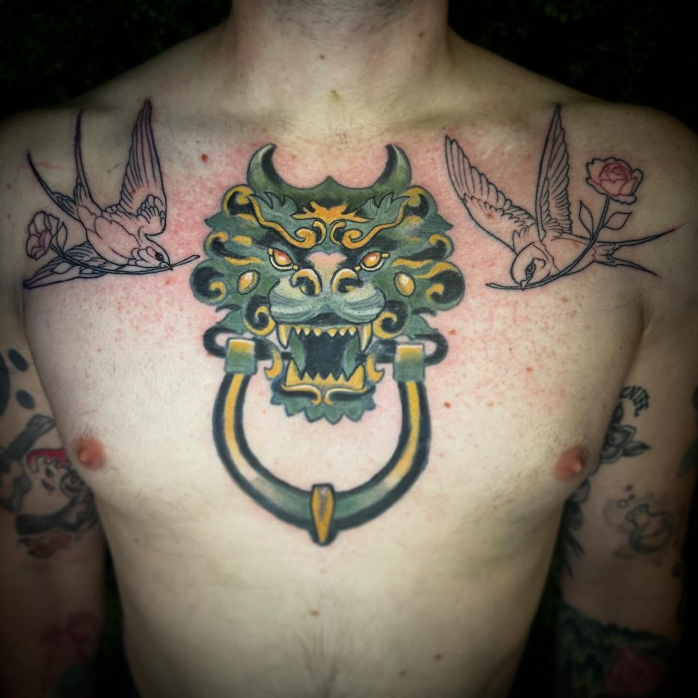Added some sparrows to the sides of this dragon-door knocker! #neotraditionaltattoos #neotraditional #colortattoo #linework #sparrows