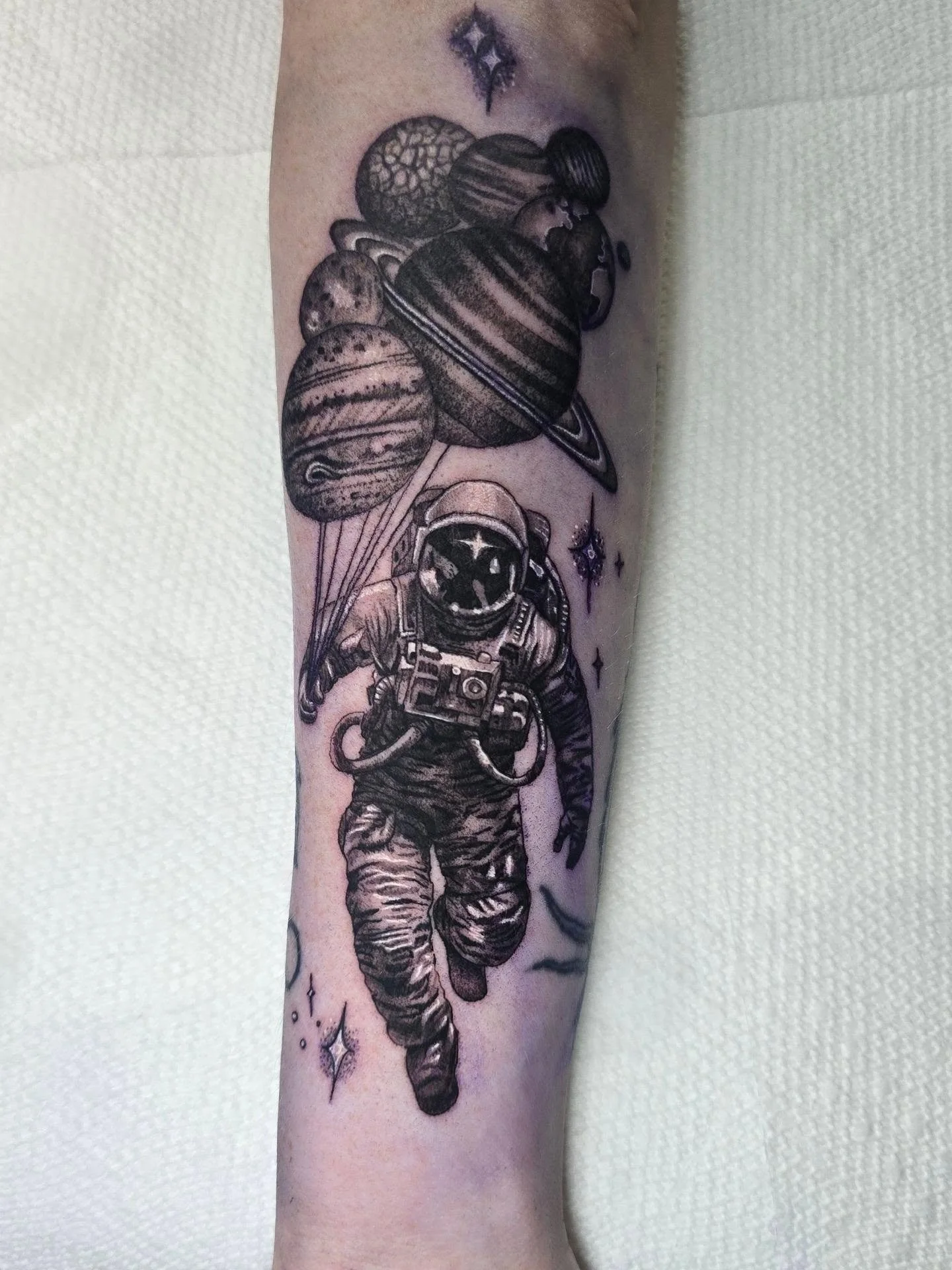 I got a chance to do an astronaut with planet balloons. I had so much fun with this piece. I loved the challenge of his suit. Such a cool piece!

 I'm booking may. Hit me up or come by the shop and let's get you in the schedule.