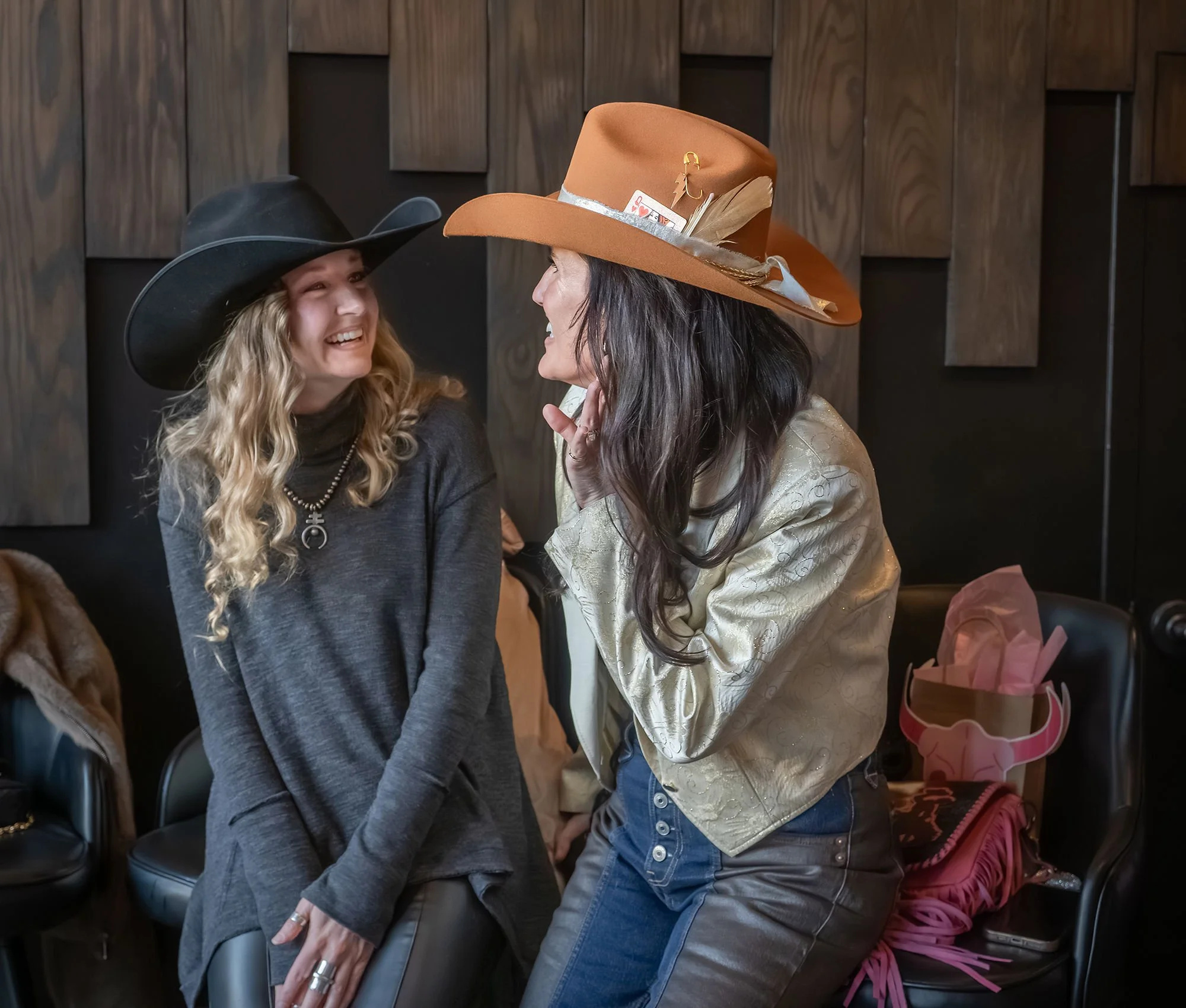 Guests engaging in a hands-on hat customization experience designed for elite weddings and VIP events.