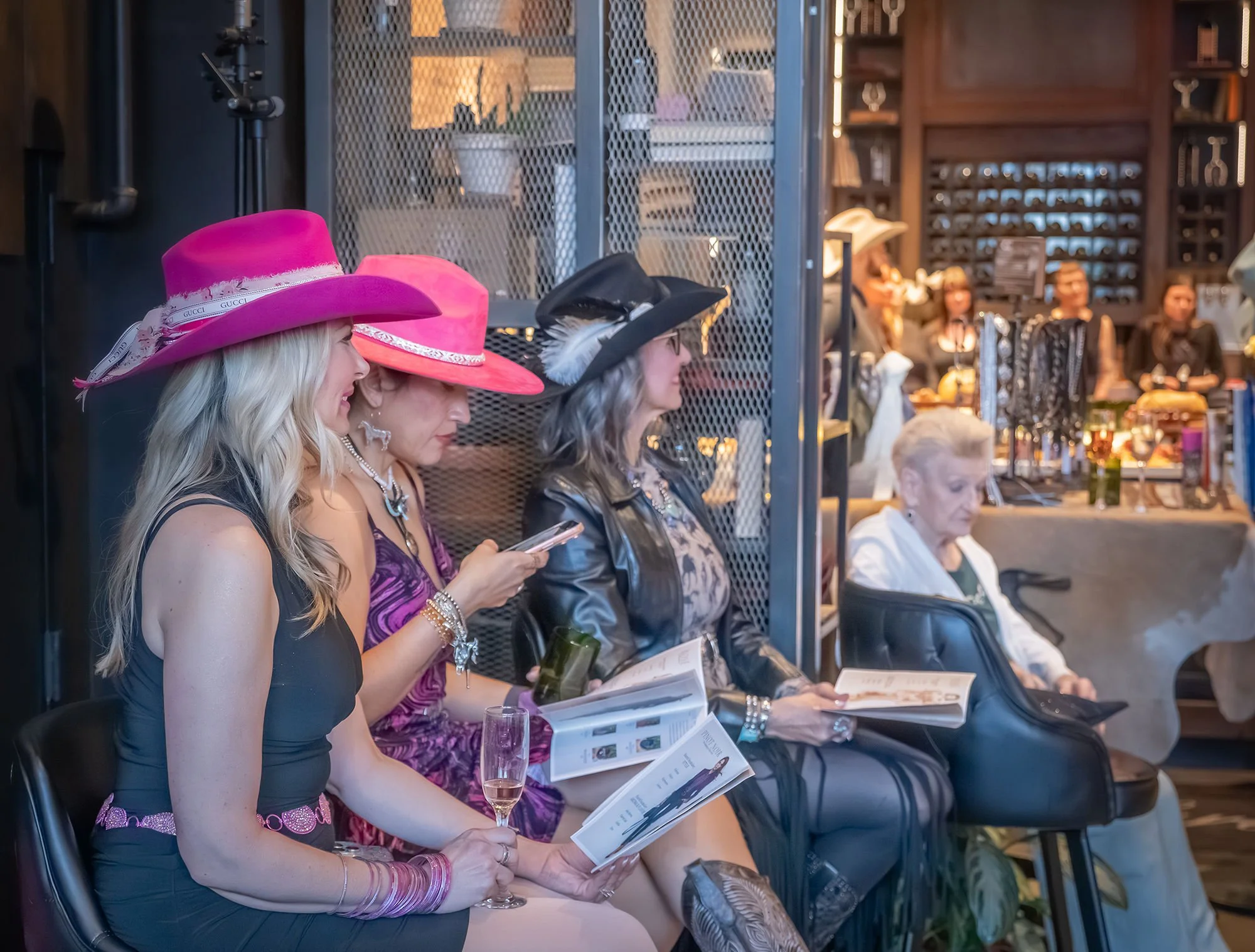 Fashion-forward hat designs styled live at Brim to Barrel, blending Western heritage with modern luxury event design.