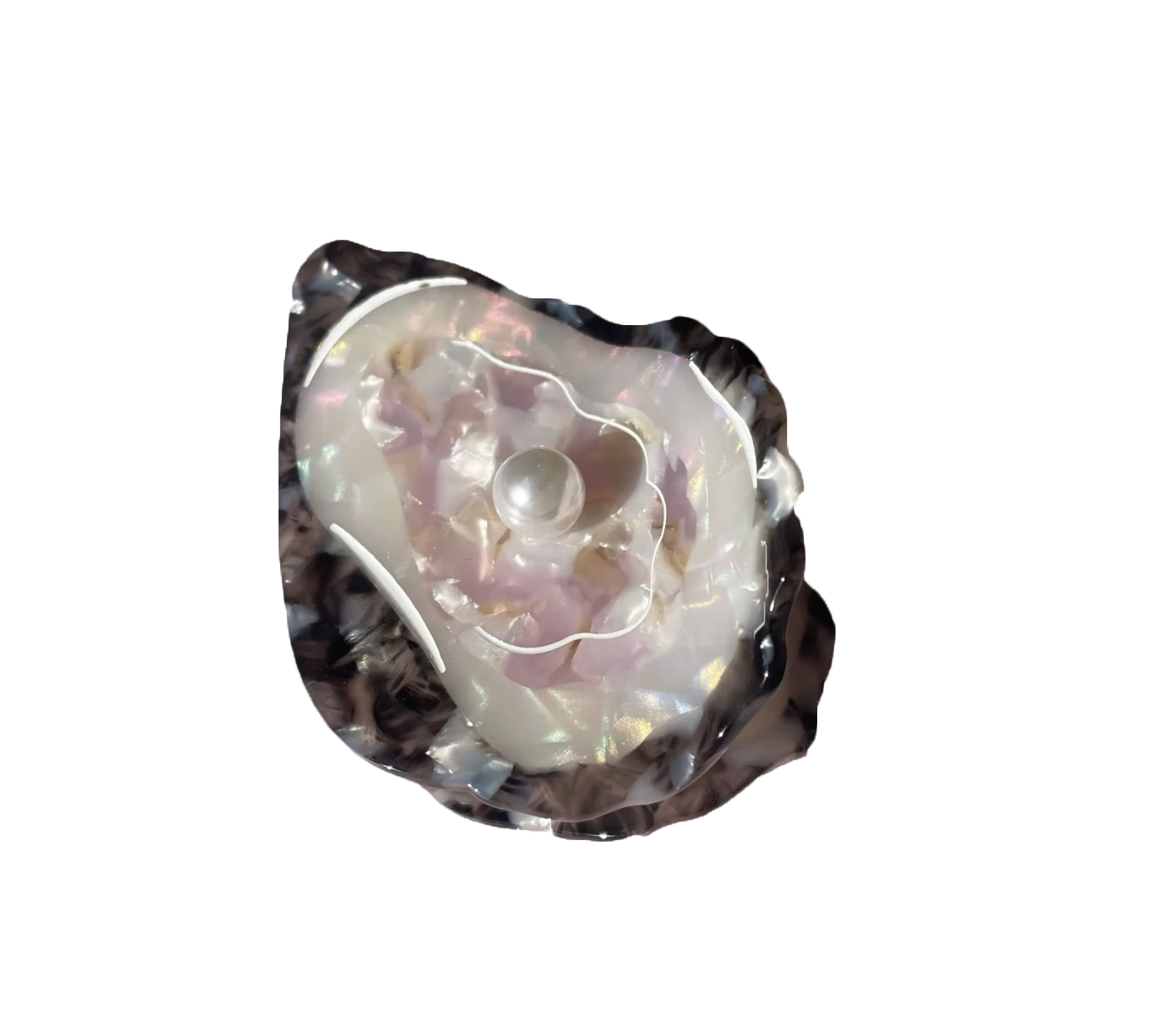 Hair clip resembling an oyster with a pearl inside.