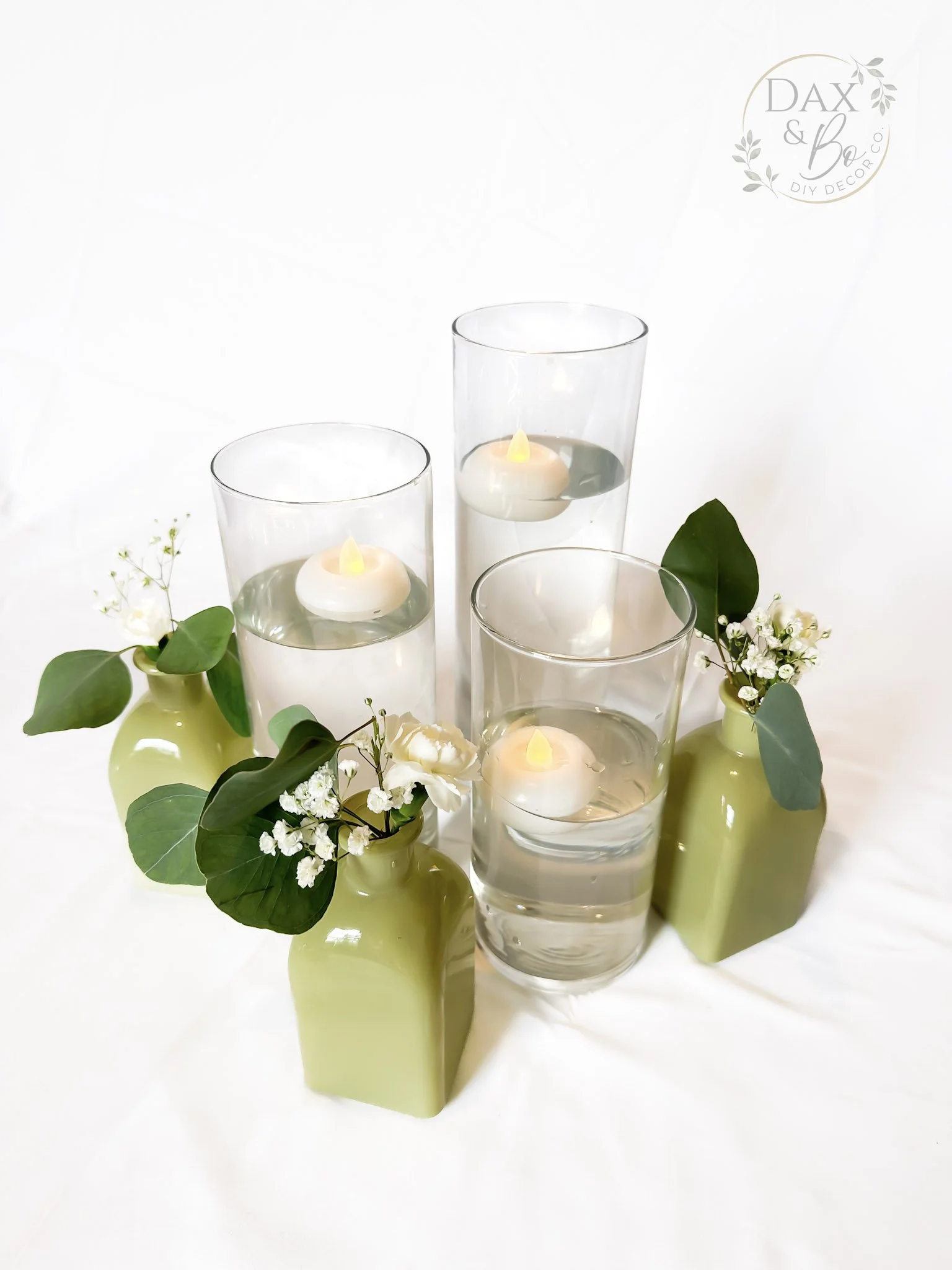 cylinder-floating-candles-green-bud-vases-daxbo.jpg