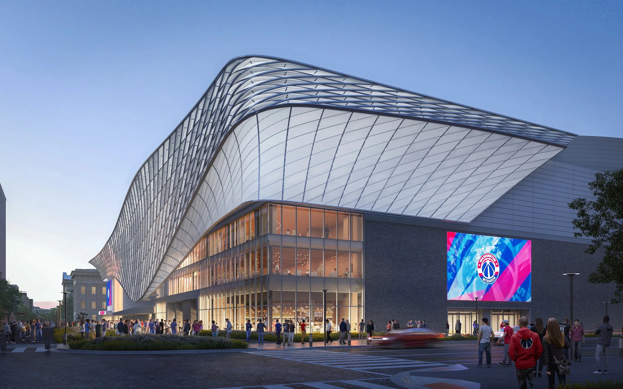 A modern, architectural building with a wavy roof structure, glass windows, and a large digital display.