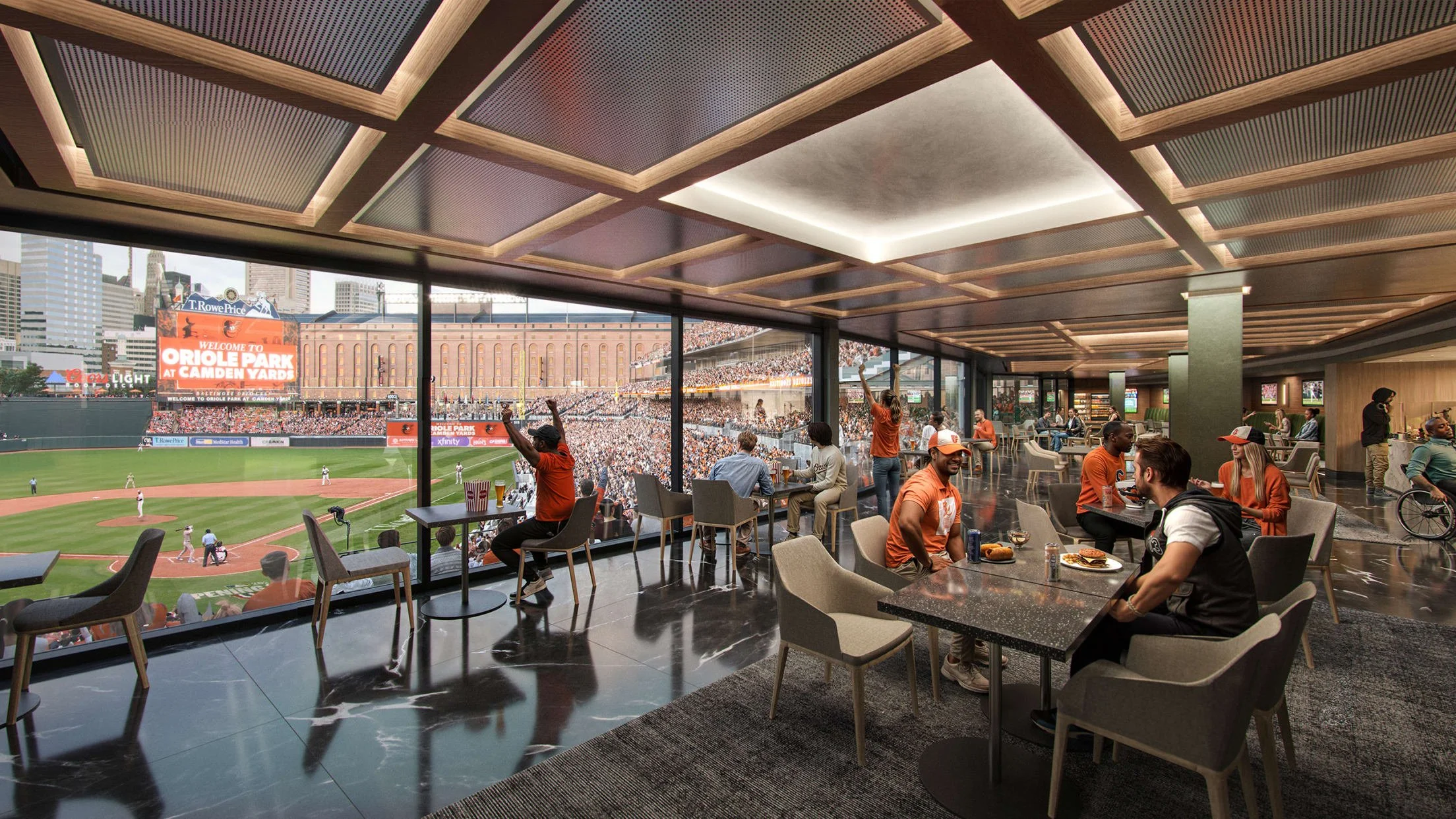 Inside a baseball stadium suite with patrons watching a game.