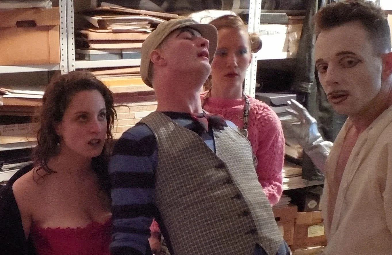 The kooky company of a staged reading of Tom Murrin's wild late 60s play "Son of Cock Strung" performed at The Club at La MaMa. Director: Ralph Lewis for Peculiar Works Project