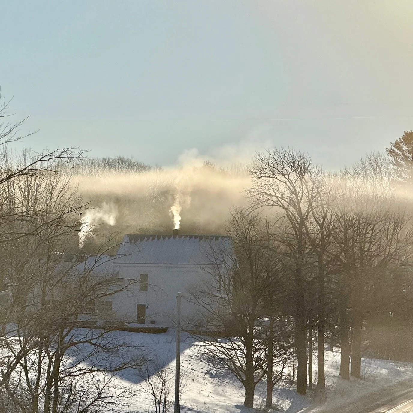 Chimney smoke rises, and a poet gets to work