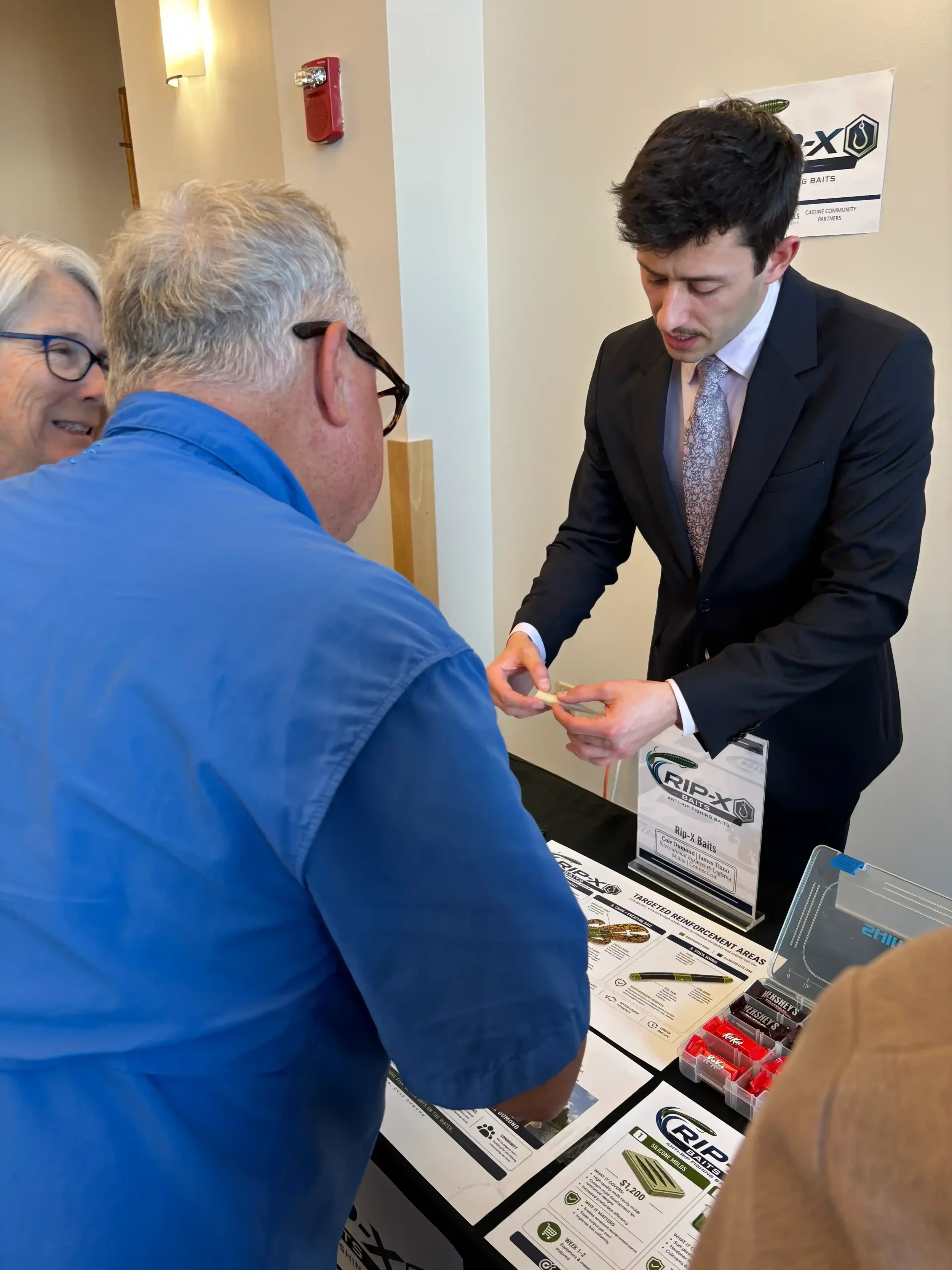 James Tiano shows his fishing lure concept to attendess.