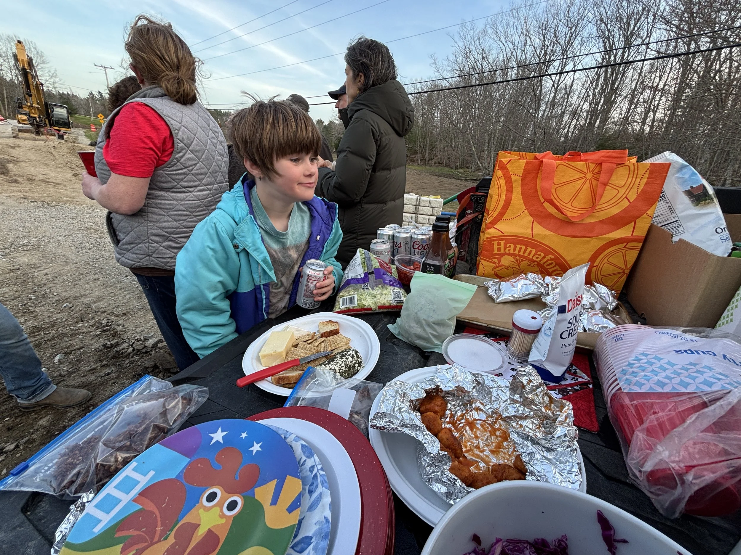 Maggie Hutchins peruses the potluck dinner.