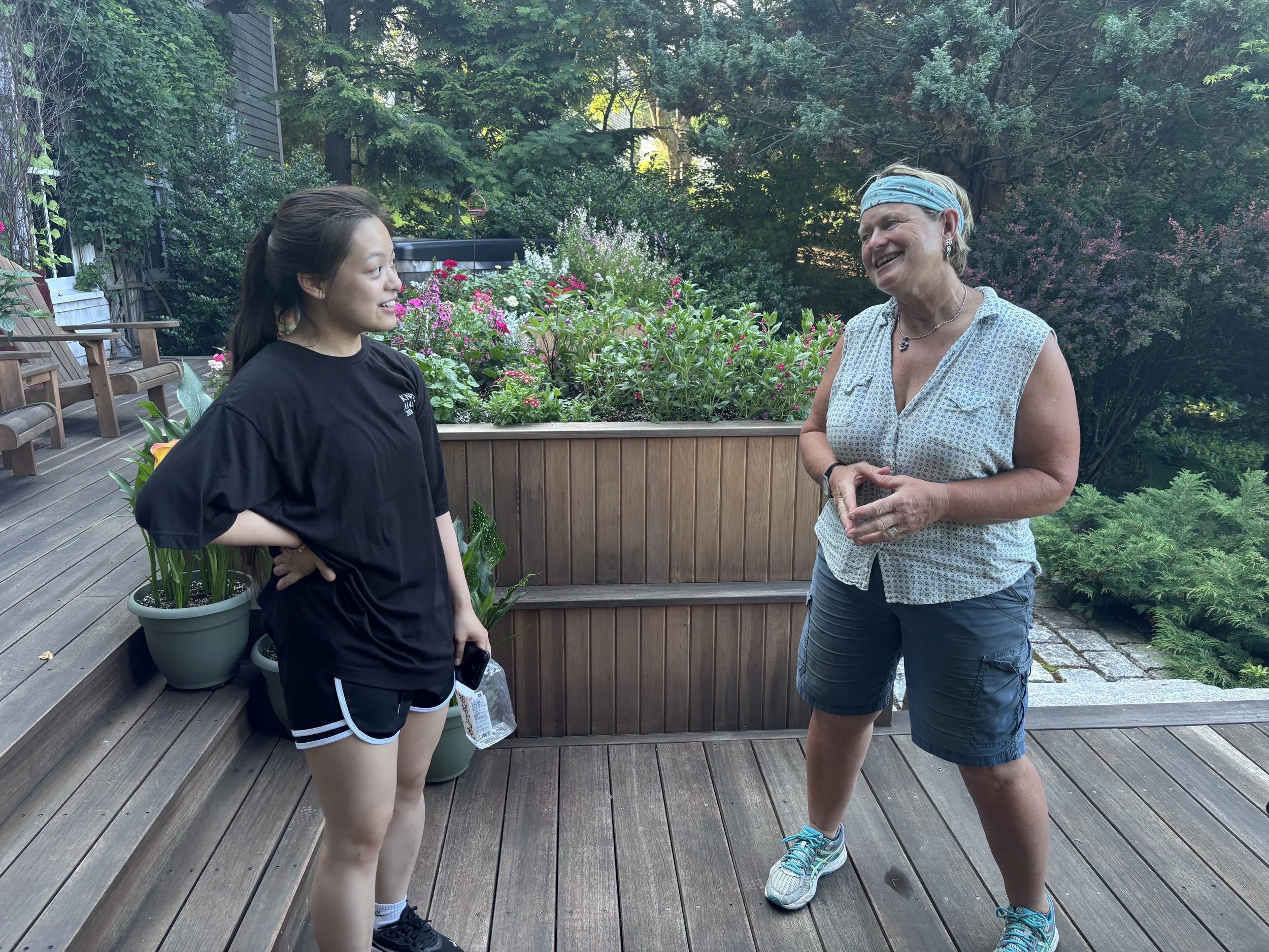 Clapp chats with visitor Tiffany Tsai of Toronto.