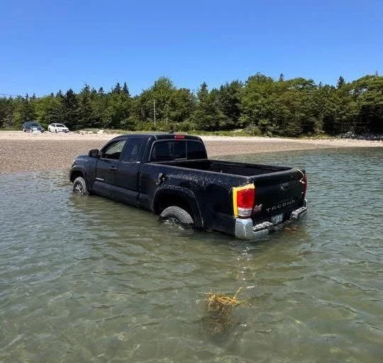Submerged truck pulled from Reach Beach