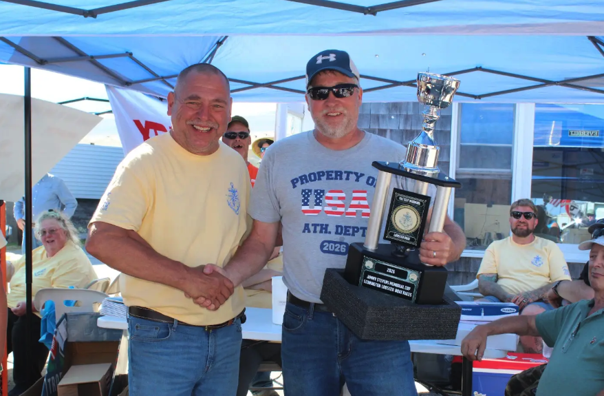 The Jimmy Stevens Cup was awarded to Sean Alley (right) of F/V Little Girl, a gasoline boat. Jeff Eaton (left) presented the award. Photo by Jessi Hardy.