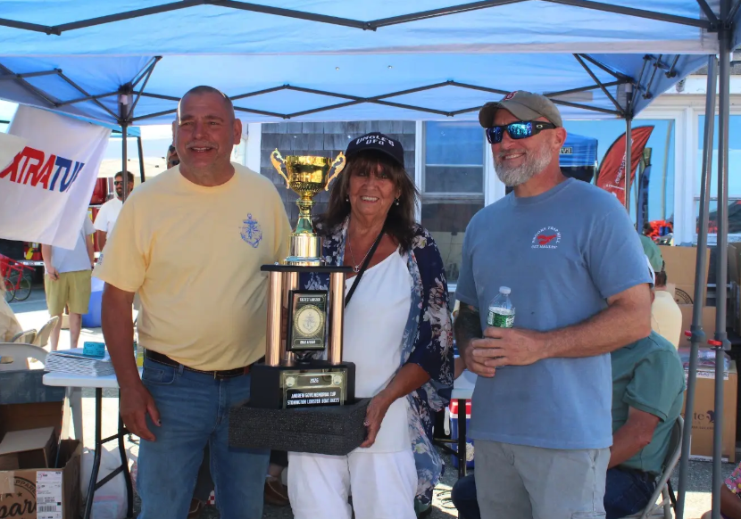 The Andrew Gove Trophy was awarded to Andrew Taylor (right) of F/V Blue Eyed Girl. The award was presented by Jeff Eaton (left) and Myrna Clifford, Gove’s daughter (middle).