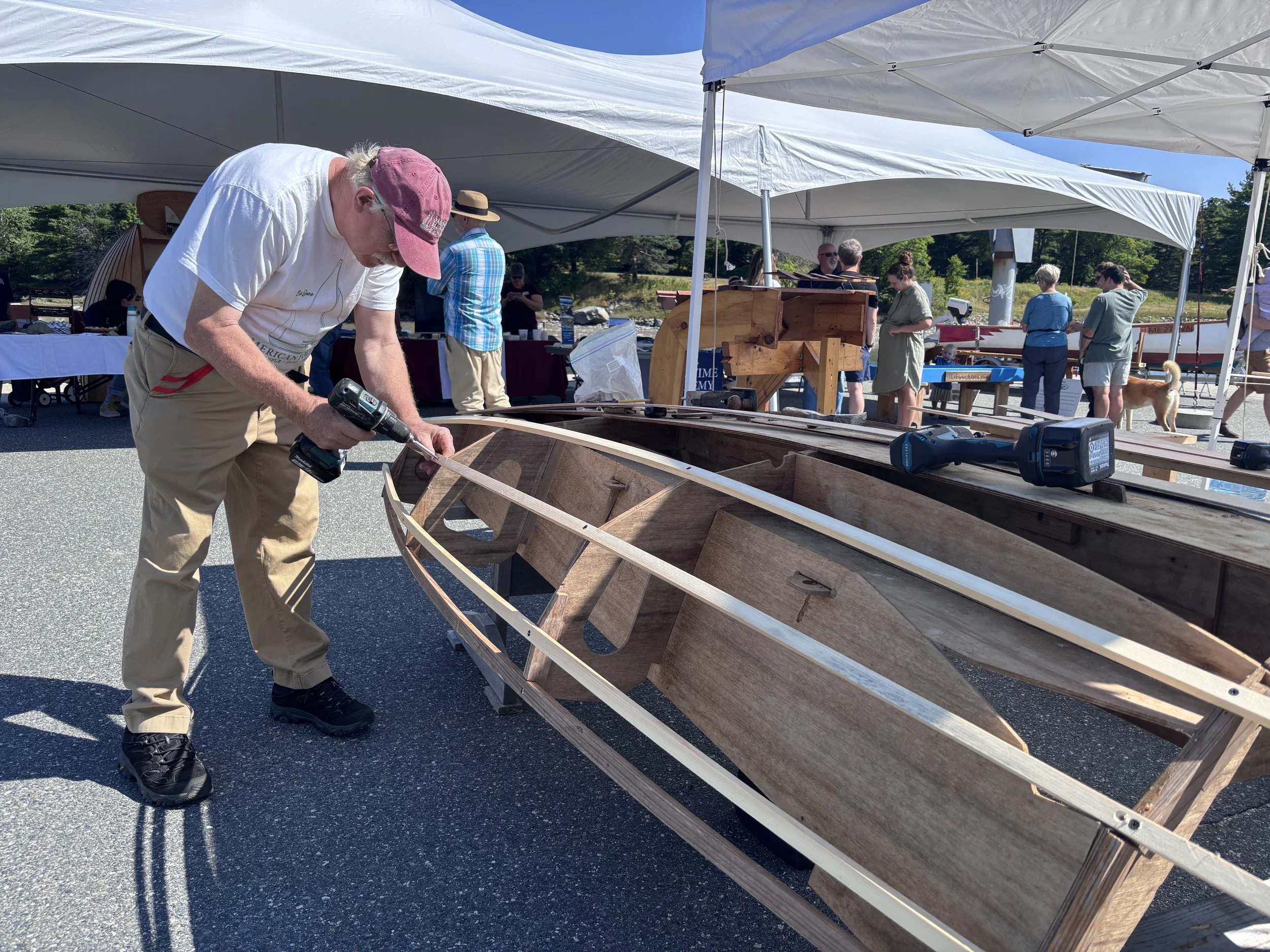 John Brooks of Blue Hill works on a boat he designed called the DragonFlyer. Photo by John Boit