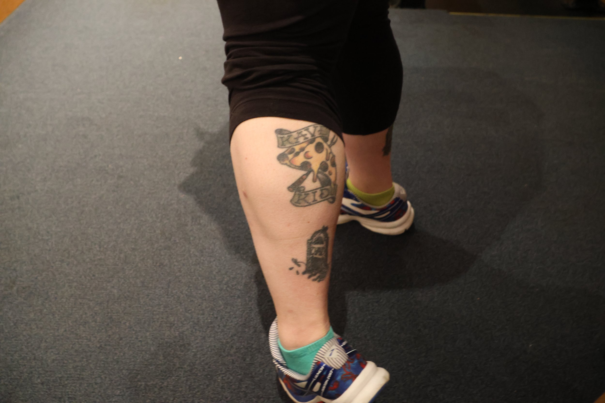 'Kave Kid' tattoo on the calf of Kali Ausplund.
