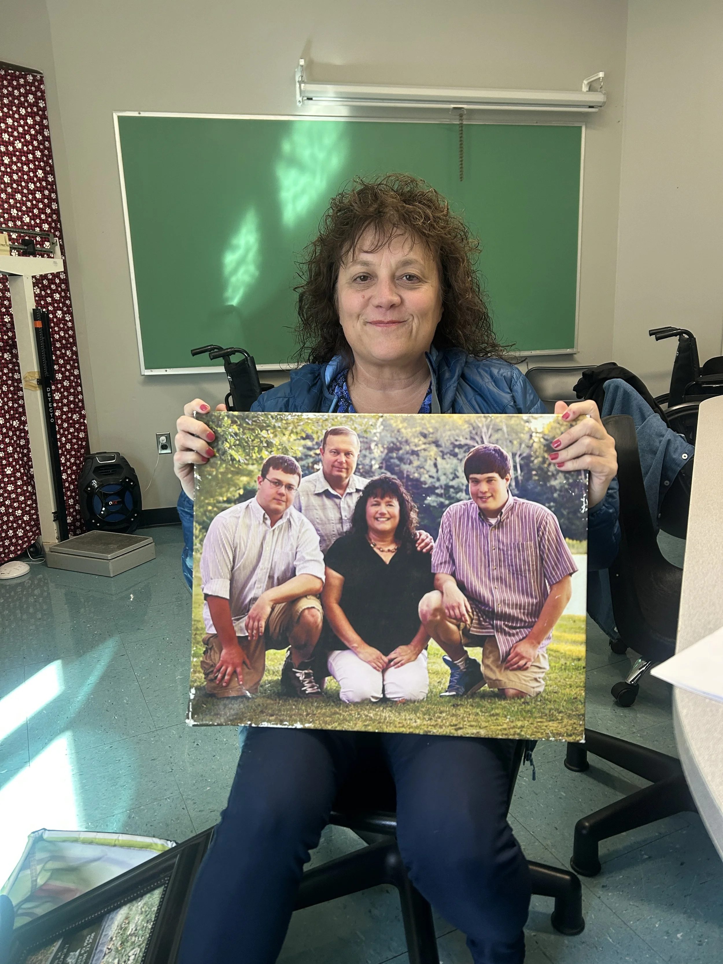 Yankowsky with a family photo of her two sons and husband. 