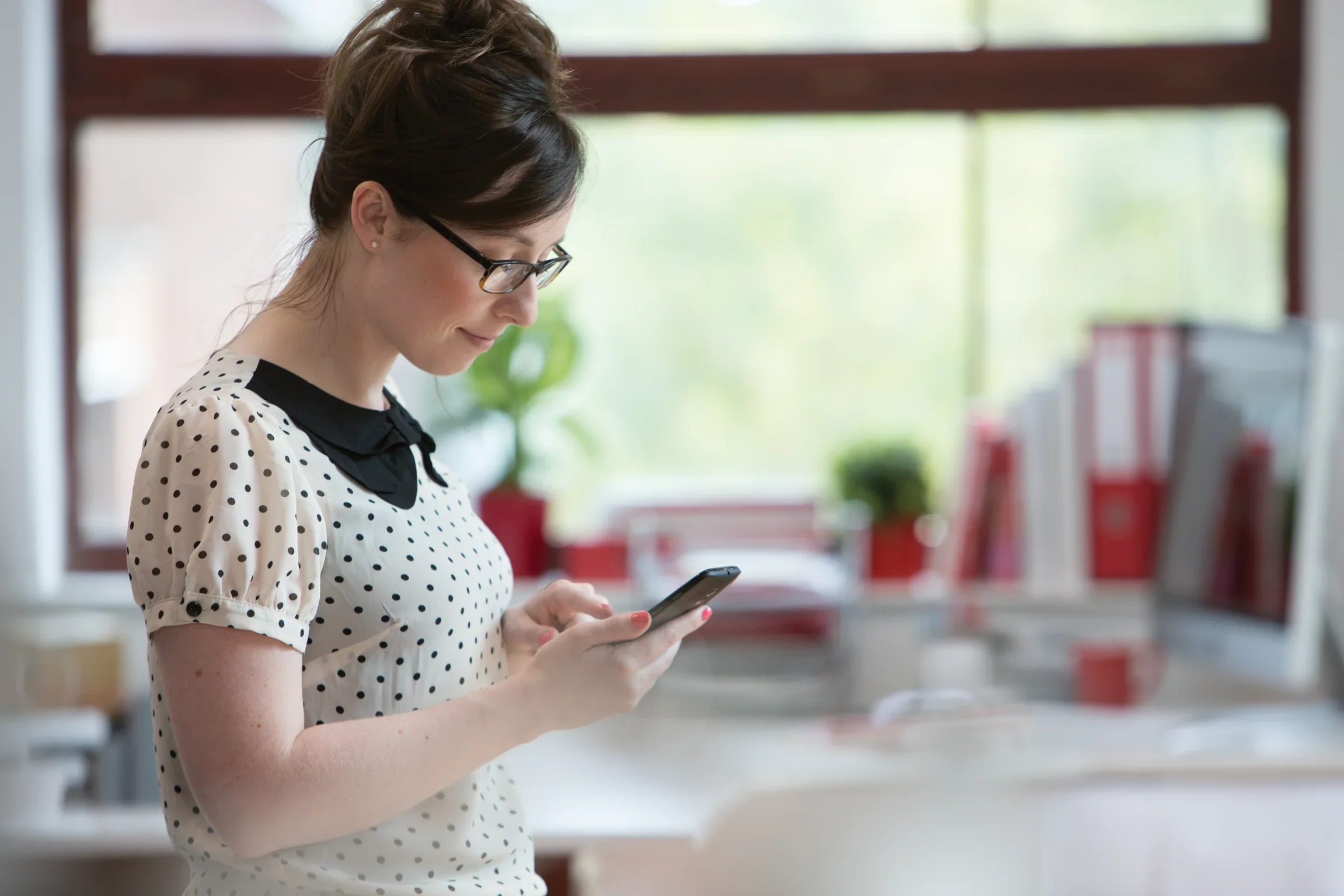 Woman using mobile phone.