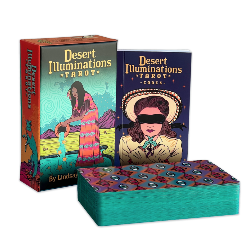 Two tarot card decks titled 'Desert Illuminations Tarot' by Lindsay, with one featuring a woman with long hair pouring water onto a desert landscape, and the other showing a woman with a hat and her eyes covered, along with a colorful spread of tarot cards.