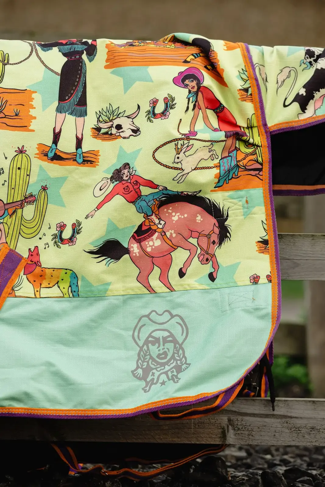 Horse blanket with vintage cowgirls and desert wild west iconography.