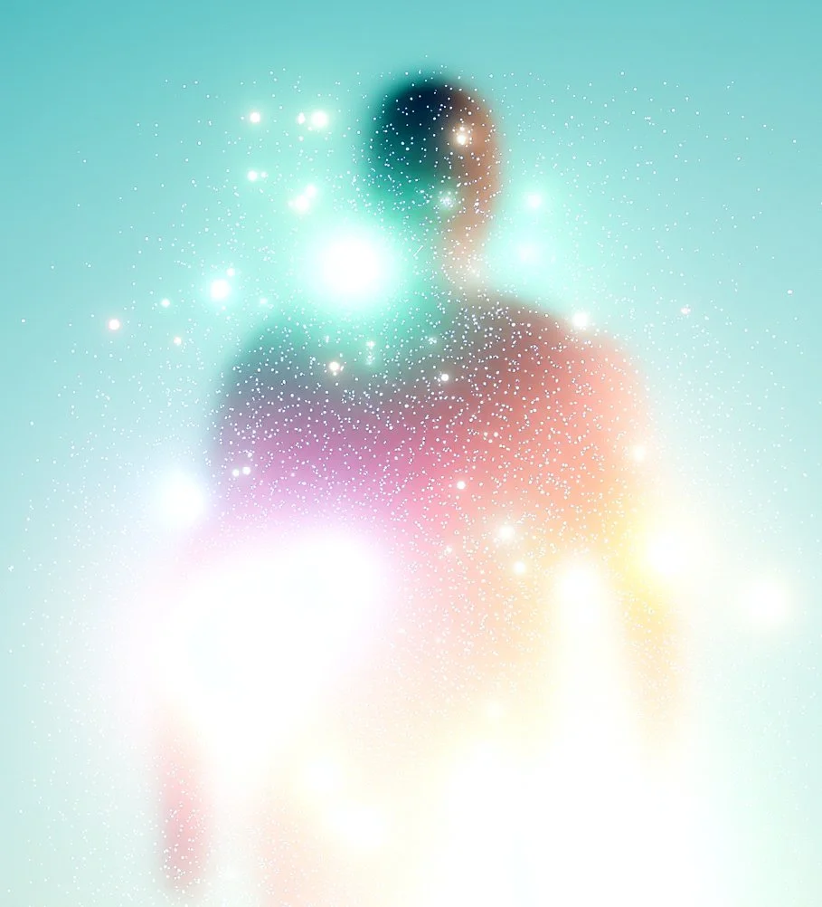A blurred silhouette of a person with colorful light effects and sparkles surrounding them, creating a dreamy or cosmic appearance.