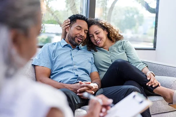 man and woman hugging in couples therapy