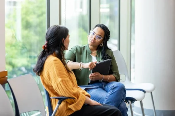 Therapist and client engaged in trauma therapy