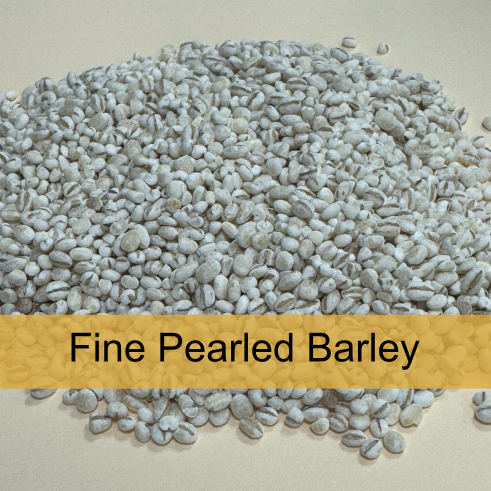 Pile of fine pearled barley grains on a light surface with a label that says 'Fine Pearled Barley' in black text on a yellow background.