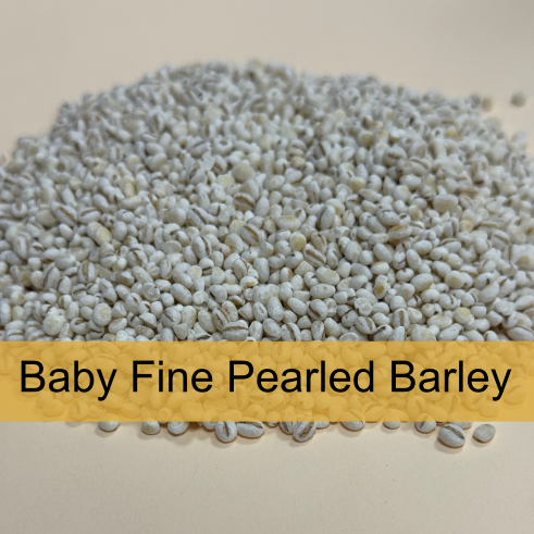 A pile of baby fine pearled barley grains with a label that says "Baby Fine Pearled Barley."