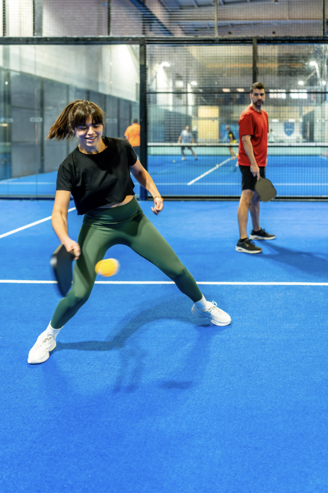 A couple playing pickleball for fun.