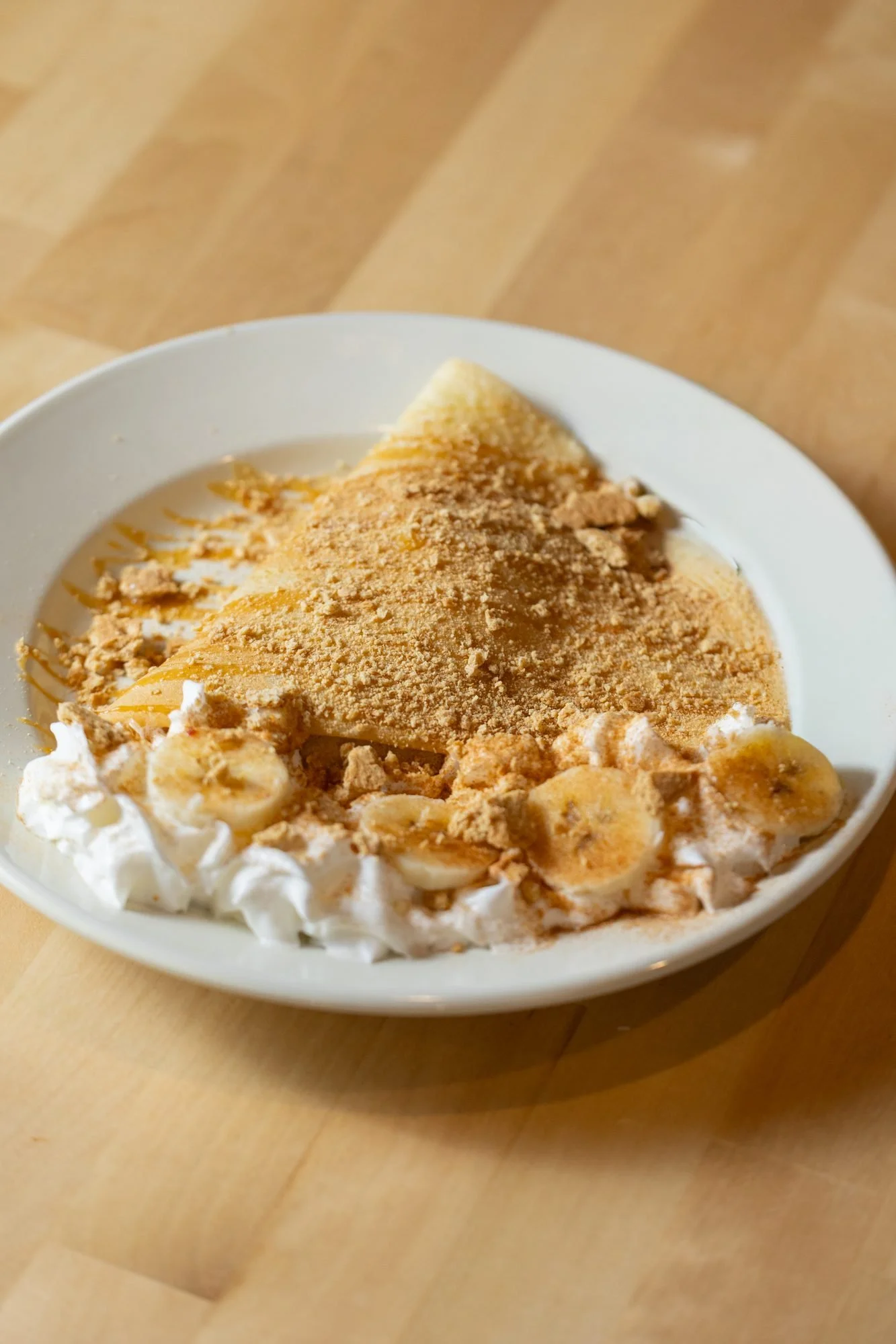Crepe with whipped cream, banana and cinnamon from The Crepery fall menu in Logan, Utah