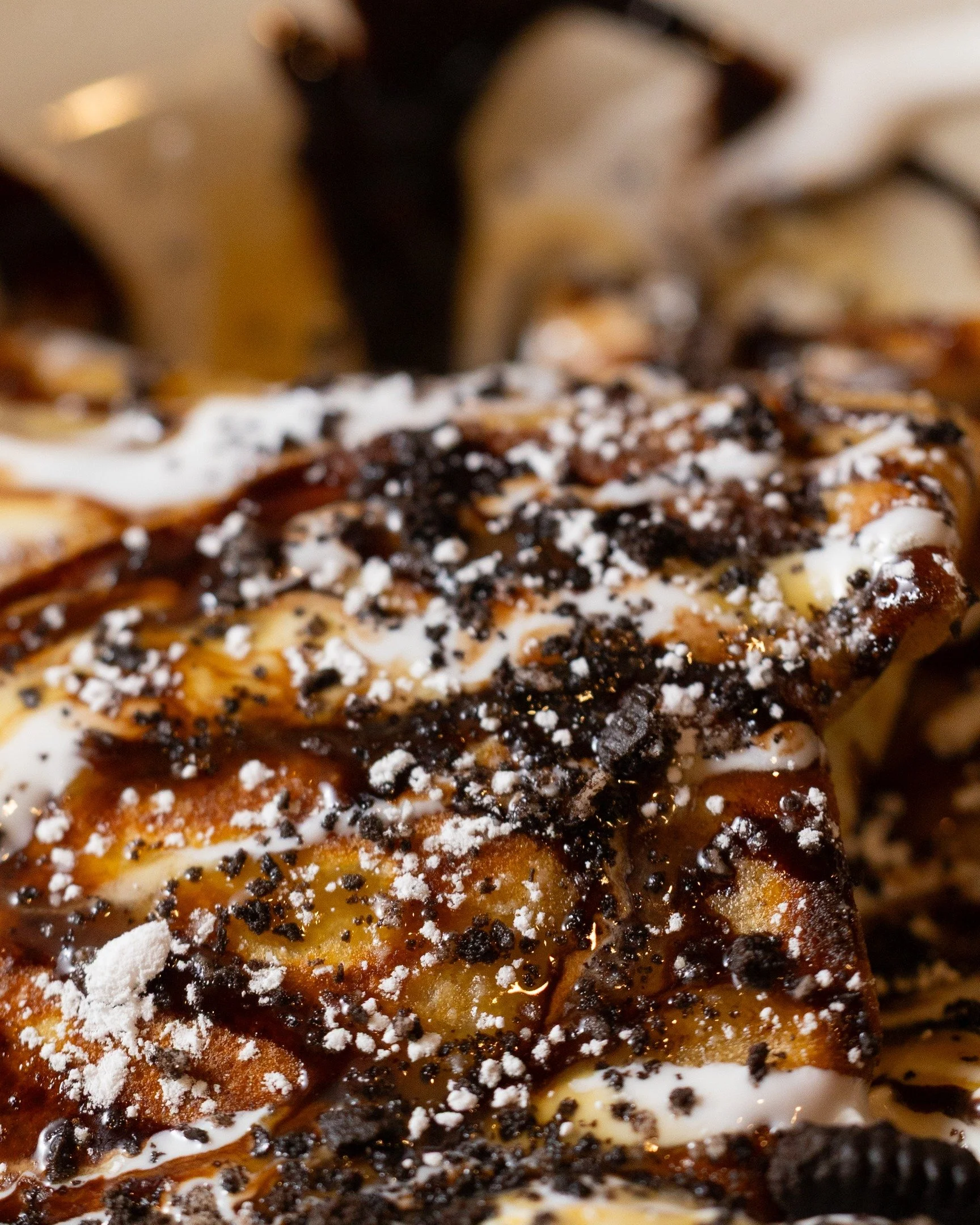 Fall menu photography for the Crepery, shot up close.

Macro shots make a dessert crepe readable on a phone: the drizzle, the cookie crumbs, the powdered sugar. Then the savory crepe gets the same treatment, so the menu has both sides covered.

Wide,