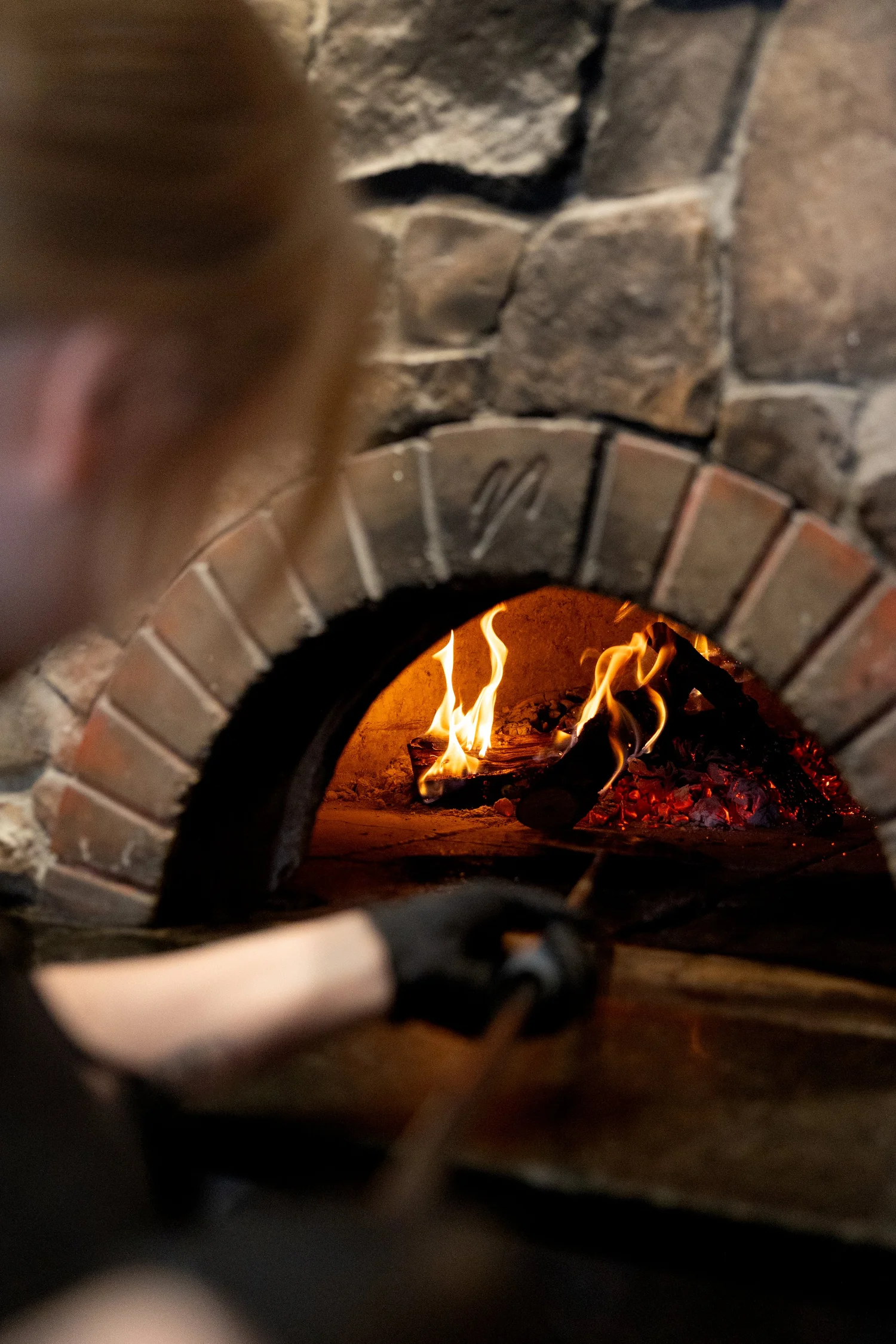 Pizza going into the wood-fired oven at Jack’s in Logan